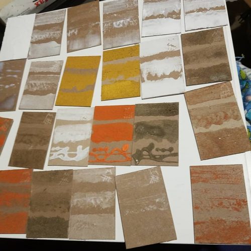 uninked drying test plates with a variety  of mediums and sands