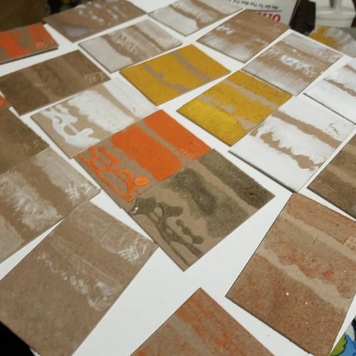 uninked drying test plates with a variety  of mediums and sands